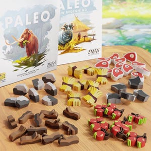 May include: A close-up of a game board with various wooden game pieces. The pieces are in different shapes and colors, including brown, gray, red, and yellow. The game board is made of wood and has a light brown color. The game is called "Paleo: A New Beginning" and is a cooperative adventure game by Peter Rustemeyer.