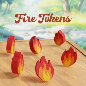 May include: Wooden fire tokens in red, orange, and yellow, arranged on a wooden surface. The tokens are shaped like flames. The words "Fire Tokens" are written in a stylized font above the tokens.