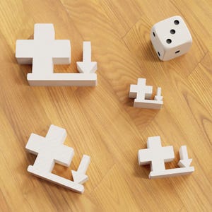 May include: A collection of white wooden puzzle pieces, each featuring a cross and a downward arrow, alongside a white die with black dots. The objects are arranged on a wooden surface, possibly for a game.
