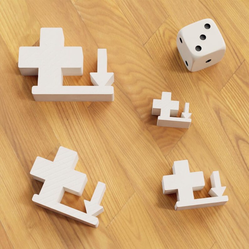 May include: A collection of white wooden puzzle pieces, each featuring a cross and a downward arrow, alongside a white die with black dots. The objects are arranged on a wooden surface, possibly for a game.