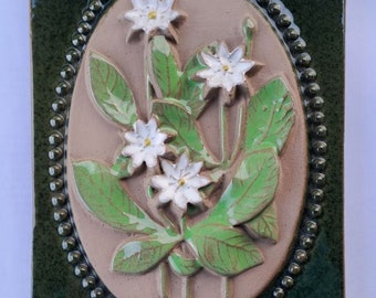 Vintage Swedish Jie Gantofta Dark Green Glazed Ceramic Wall Plaque with Arctic Starflowers, designed by Aimo Nietosvuori, hand painted