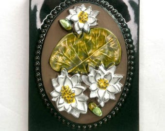Vintage Swedish Jie Gantofta Dark Green Glazed Ceramic Wall Plaque with Water Lilies (Näckros), designed by Aimo Nietosvuori