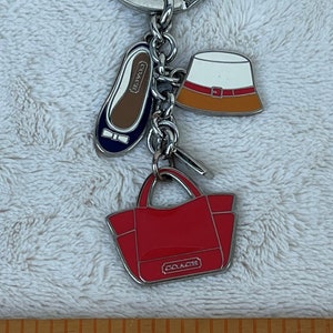 Coach Perforated Coach Bag Charm  Bag charm, Coach bags, Clothes