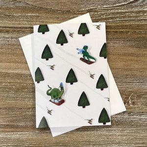 Dinossauros Frios | Cartão festivo do dinossauro de <br> Entrega Rápida? Dinossauros esquiando | Snowboard T-rex | Braquiossauro de trenó | Cópias de esqui | Cartão dinossauro
