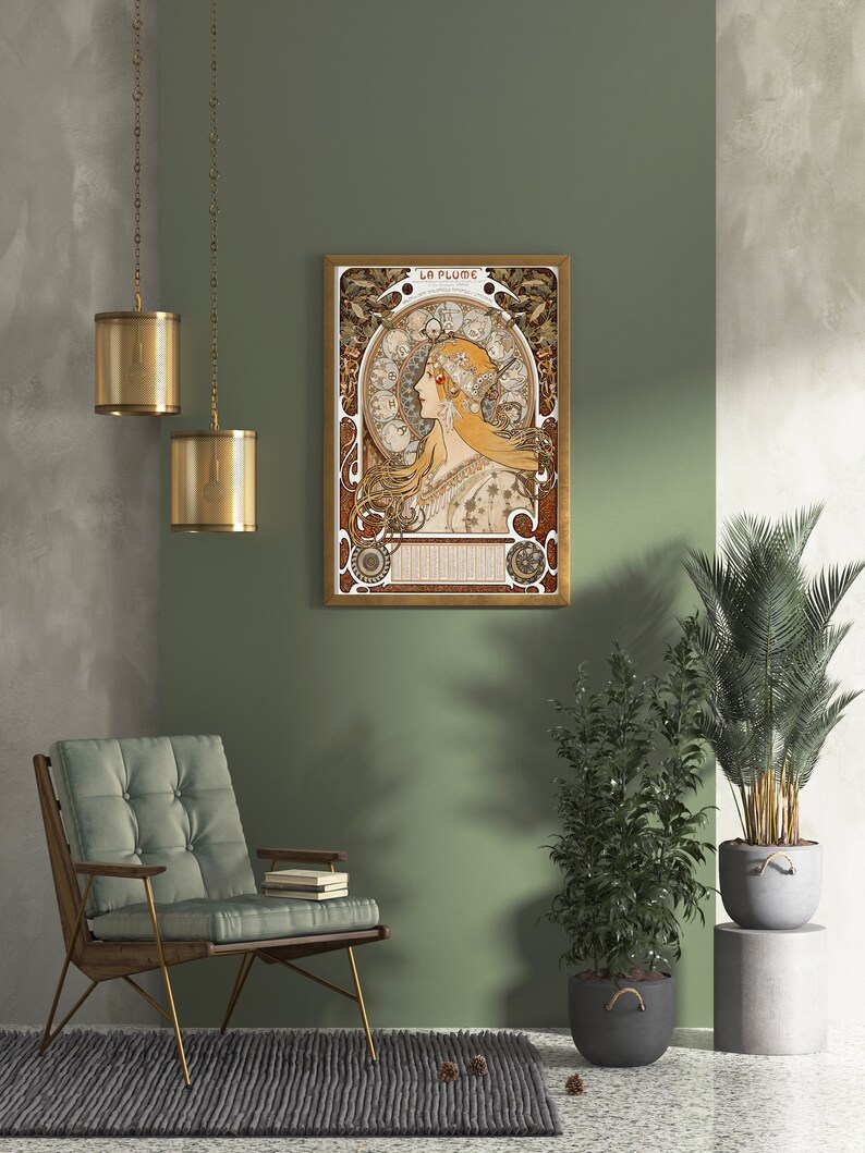 May include: A framed art print with a gold frame. The print features a woman with long flowing hair and a crown of flowers. The print is titled "La Plume".
