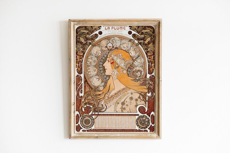 May include: A vintage poster with a decorative frame featuring a woman with long flowing hair and a crown of flowers. The poster is titled "La Plume" and features a circular design with zodiac symbols.