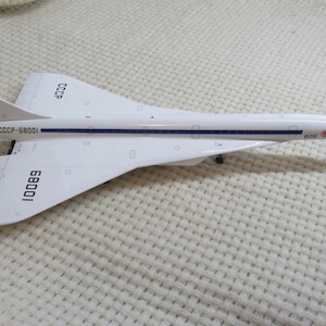 Model of Tu-144 CCCP - 68001 in 1-100 scale. Perfect addition for your collection.