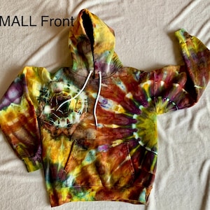May include: A tie-dye hoodie with a swirling pattern of yellow, orange, red, purple, and green. The hoodie has a drawstring hood and a kangaroo pocket.