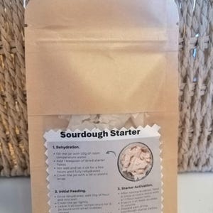 May include: A set of three ceramic mugs with a speckled, matte finish in cream, light grey, and dark grey. Each mug has a simple, minimalist design and a rounded handle.