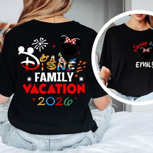 May include: Black t-shirt with a Disney Family Vacation 2026 design. The design includes the Disney logo, Mickey Mouse, Goofy, Donald Duck, and fireworks. A smaller image shows a black t-shirt with a Minnie Mouse design and the name "Emily".