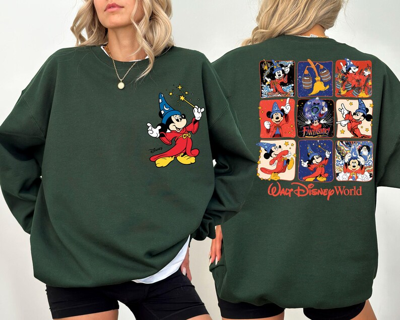 May include: Dark green sweatshirt featuring a Mickey Mouse graphic on the front and back. The front graphic shows Mickey as a sorcerer with a wand. The back has a grid of Mickey Mouse images and the words "Walt Disney World".