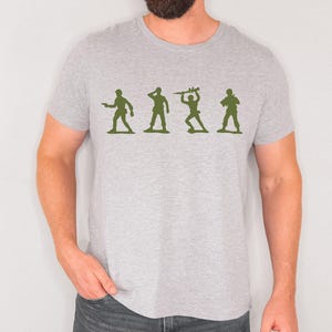 May include: A set of three ceramic mugs with a speckled, matte finish. The mugs are in shades of cream, light gray, and dark gray. Each mug has a simple, minimalist design, perfect for coffee or tea.