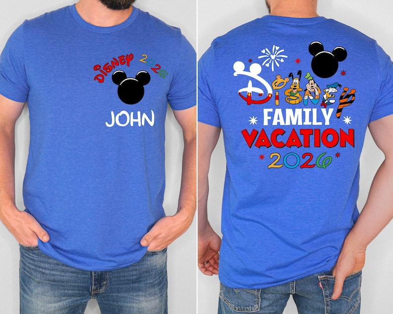 May include: Blue t-shirt with "Disney 2026" and a Mickey Mouse head graphic on the front. The name "JOHN" is printed below. The back features "Disney Family Vacation 2026" with character illustrations and fireworks.