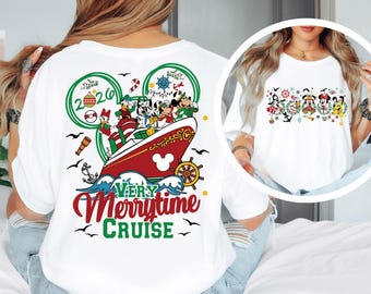 May include: A white t-shirt featuring a large back graphic of a red and white cruise ship with Disney characters, a 2026 ornament, and the text Very Merrytime Cruise. A smaller circular inset shows the same characters in holiday wreaths.