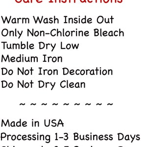 May include: White background with red text that reads "Care Instructions." The instructions include: warm wash inside out, only non-chlorine bleach, tumble dry low, medium iron, do not iron decoration, and do not dry clean.