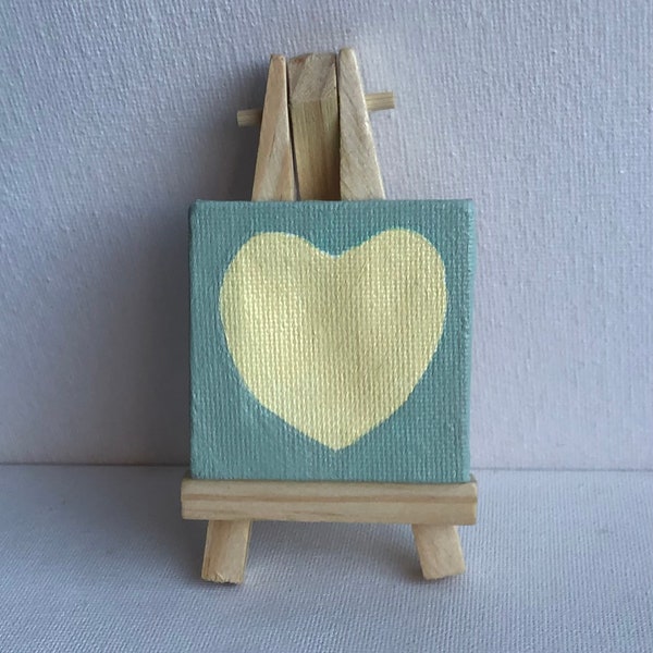 Little heart on canvas with easel