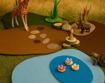 Playmats in a set: brown and green felt mats with tufts of grass for a savannah landscape
