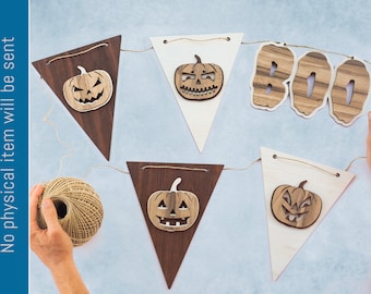 Puede incluir: Un banderín de Halloween con banderas triangulares marrones y blancas. Las banderas tienen recortes de calabazas con caras de jack-o'-lantern y la palabra "BOO" en un patrón de veta de madera. El banderín está encordado con hilo.
