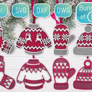 May include: A set of eight Christmas ornaments featuring a variety of winter-themed designs, including mittens, hats, and sweaters. The ornaments are made of white and red wood and have a festive, Scandinavian-inspired look.