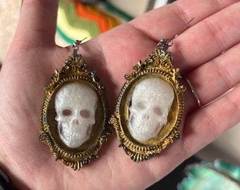 Gold frame skull earrings