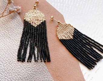 Long earrings with black and gold fringes