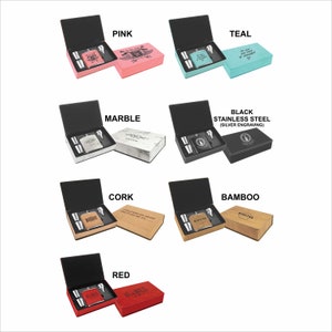 May include: Set of six different flask gift sets with various wood, marble, and colored finishes. Each set includes a flask, two shot glasses, and a box with a personalized inscription.