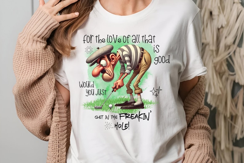 May include: White t-shirt with a cartoon golfer and the text "for the love of all that is good, would you just get in the freakin' hole!"