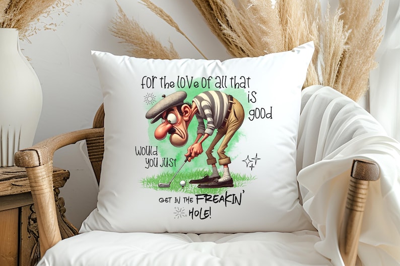 May include: White pillow with a cartoon golfer illustration and the text "for the love of all that is good, would you just get in the freakin' hole!"