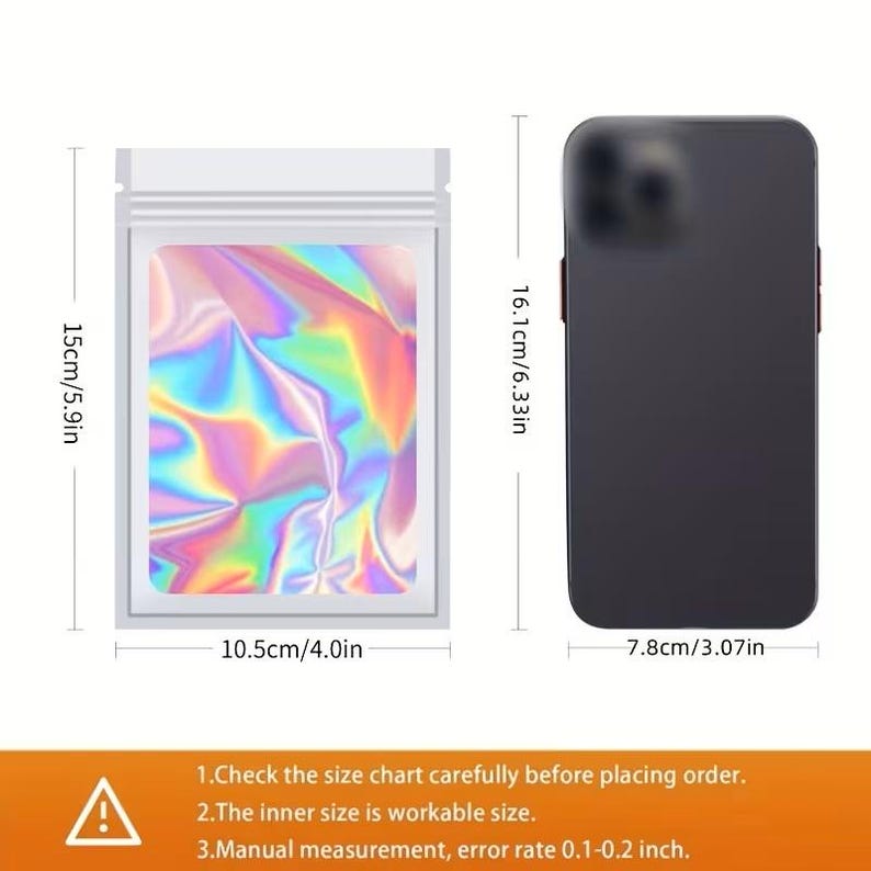 May include: A white, resealable bag with a holographic interior, measuring 15cm x 10.5cm (5.9in x 4.0in). A black smartphone is next to the bag, measuring 16.1cm x 7.8cm (6.33in x 3.07in). Text on the image advises checking the size chart.