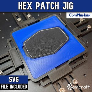 May include: A black and blue Hex Patch Jig with the text HEX PATCH JIG, ComMarker, and SVG FILE INCLUDED. The jig features a central blue frame holding a black hexagonal patch with white stitching, secured by adjustable black mounting brackets.