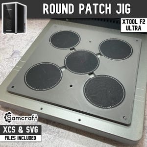 May include: A grey round patch jig for the xTool F2 Ultra laser machine. The device features a flat base with five circular recessed areas designed to hold round patches in place. The text Round Patch Jig and xTool F2 Ultra are visible.