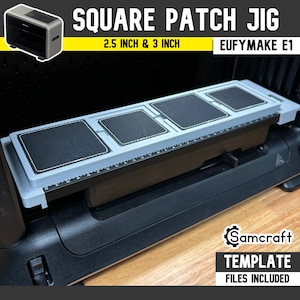 May include: A light gray square patch jig for the EufyMake E1, featuring four recessed square slots for 2.5 inch and 3 inch patches. The jig includes a black base with a printed ruler along the side and text reading SQUARE PATCH JIG.