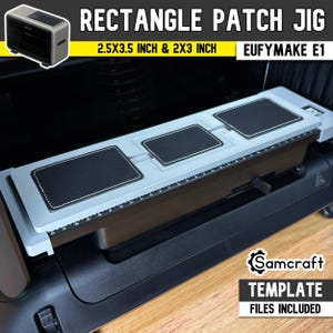May include: A light grey rectangle patch jig for the EufyMake E1, featuring three black rectangular patches with white stitching. The jig includes a printed ruler along the side and text stating 2.5x3.5 inch & 2x3 inch dimensions.