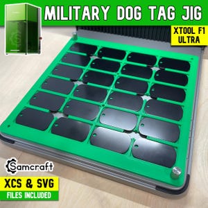 May include: A green and silver Military Dog Tag Jig with black dog tags. The jig has the text "MILITARY DOG TAG JIG" and "XTOOL F1 ULTRA". The logo for Samcraft is visible, along with the text "XCS & SVG FILES INCLUDED".