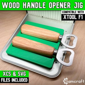 May include: A green plastic jig for a wood handle bottle opener, compatible with xTool F1, featuring two slots for openers. The jig is set on a silver metal base. Text includes WOOD HANDLE OPENER JIG, COMPATIBLE WITH XTOOL F1, XCS & SVG FILES INCLUDED.