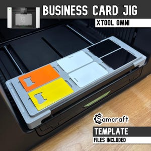 May include: A gray plastic business card jig for the xTool Omni alignment system, featuring slots holding two black cards, two white cards, one orange card, and one yellow card. The jig is labeled with the text Samcraft OMNI JIG ALIGNMENT SYSTEM.