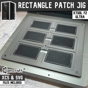 May include: A gray Rectangle Patch Jig with six black leather patches, each outlined with white stitching. The text "RECTANGLE PATCH JIG" is at the top. The image also includes the text "XTOOL F2 ULTRA" and "Samcraft XCS & SVG FILES INCLUDED".