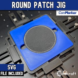 May include: A blue square jig with a circular cutout holding a black circular patch with white stitching. The jig is mounted on a black base with adjustable black brackets and silver screws. Text reads ROUND PATCH JIG, ComMarker, and SVG FILE INCLUDED.
