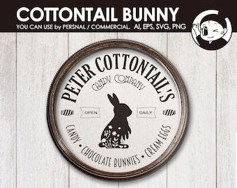 May include: A circular sign featuring a black silhouette of a rabbit with floral details on its body. The text reads PETER COTTAIL'S CANDY COMPANY, OPEN DAILY, CANDY, CHOCOLATE BUNNIES, and CREAM EGGS. The sign has a dark brown frame and white background.