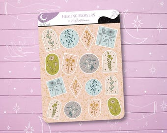 May include: A sheet of stickers featuring illustrations of various flowers and plants in a minimalist style. The stickers are on a peach background with gold glitter accents. The text "HEALING FLOWERS" is at the top of the sheet.