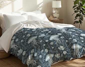 May include: A blue and white bedding set with a floral pattern featuring jellyfish. The bedding is made of soft, comfortable fabric and is perfect for adding a touch of whimsy to any bedroom.