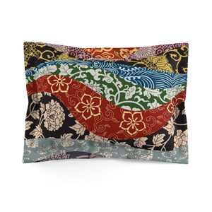 May include: A decorative cushion with a patchwork design featuring a variety of colourful floral and geometric patterns. The cushion is made of a soft, comfortable fabric and has a subtle sheen.