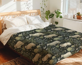 May include: A dark green duvet cover with a white sheep and floral pattern. The duvet cover is on a bed with white pillows and a wooden headboard.