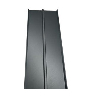 May include: A black metal sheet with a textured surface and a raised seam down the center.