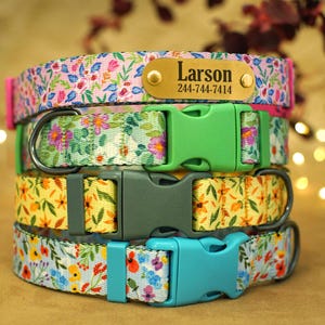 May include: Four colorful dog collars with floral patterns. The top collar has a gold name tag with the name "Larson" and phone number "244-744-7414".