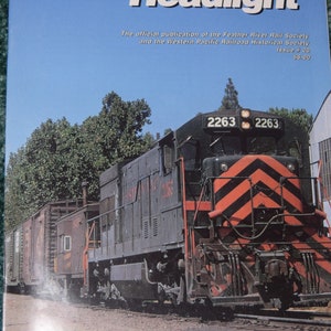 May include: A black and red diesel locomotive with the number 2263 on the front. The locomotive is pulling a train of boxcars. The magazine cover reads "Western Pacific Headlight" and is the official publication of the Feather River Rail Society and the Western Pacific Railroad Historical Society. Issue #20, $6.00.