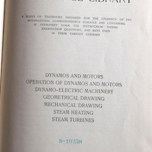 May include: An open book with the title "I. C. S. REFERENCE LIBRARY" at the top. The page lists various technical subjects including "DYNAMOS AND MOTORS" and "STEAM TURBINES". The book is from the International Textbook Company.