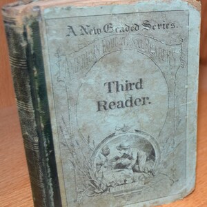 May include: A vintage, green and blue hardcover book titled "A New Graded Series. American Educational Readers. Third Reader."