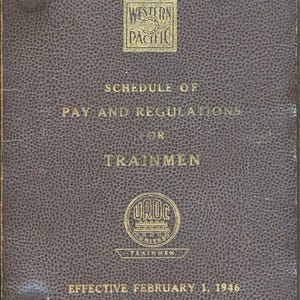 May include: A vintage brown booklet titled "Schedule of Pay and Regulations for Trainmen" from the Western Pacific Railroad Co. The cover features gold lettering and logos, including the Western Pacific logo and the UROC logo. The booklet is dated February 1, 1946.