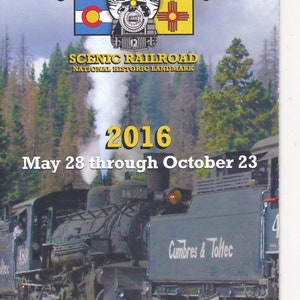 May include: A yellow and red poster advertising the Cumbres & Toltec Scenic Railroad. The poster features a black and green steam train with the text "STEAM TRAIN" and "Cumbres & Toltec Scenic Railroad National Historic Landmark" in large, bold letters. The poster also includes the text "2016 May 28 through October 23" and "Kids Ride Free! CumbresToltec.com".